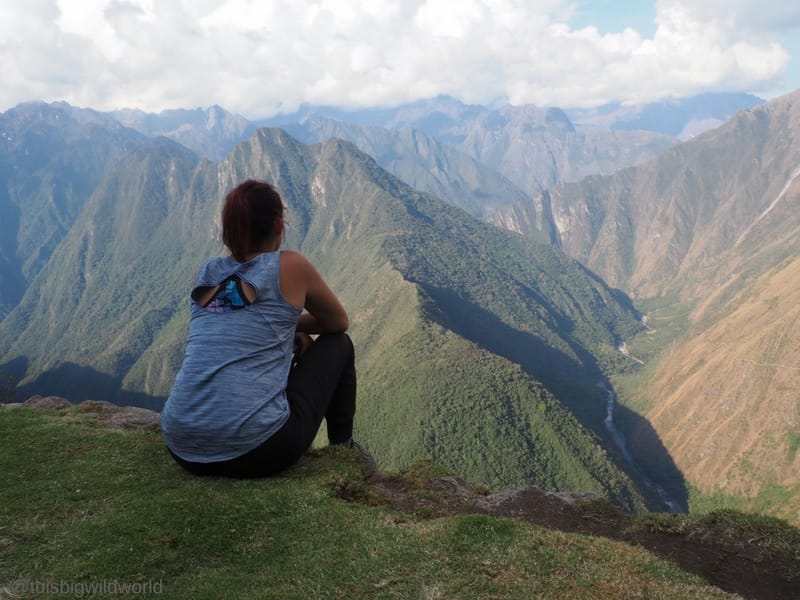 Image of me looking out at the Andes Mountains from the ruins at the end of Day 3 on the Inca Trail hike.