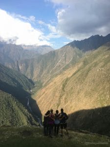 Image of my squad looking out at the Andes Mountains at the end of Day 3 of the Inca Trail hike.
