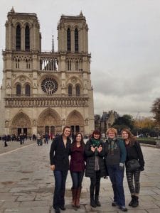 Image of me and four cousins in front of Notre Dame Cathedral in Paris.