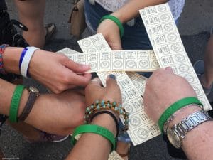 Image of my cousin's matching travel bracelets and drink tickets at a concert in Minneapolis Minnesota.