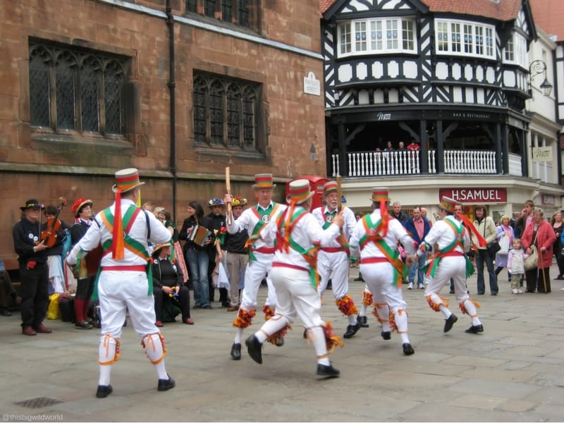Image of dancers in the city centre of Chester during a St. George's Day celebration in England.