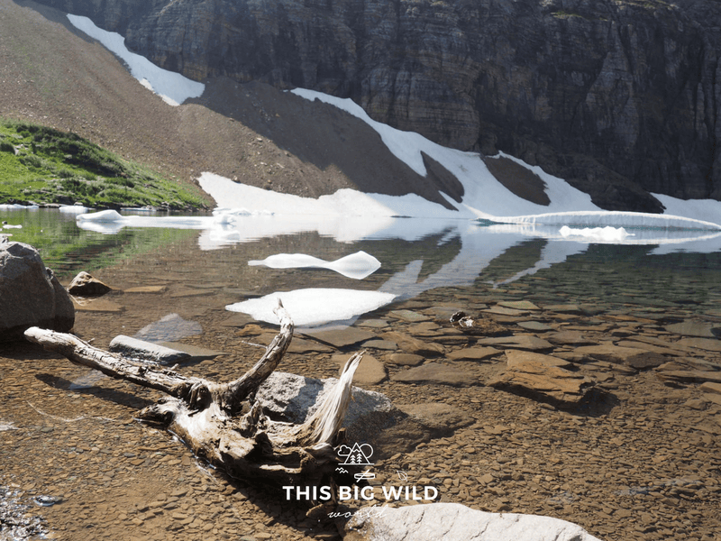 Iceberg Lake offers perfect reflections of the landscape in its glacial water.