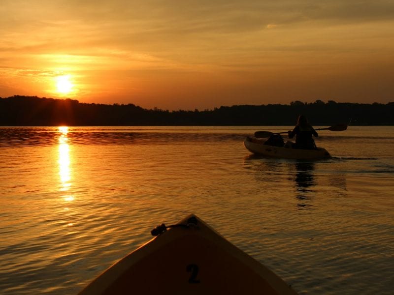 Kayaking at sunset is just one of many activities to enjoy at Deer Creek State Park in Ohio. Photo by Tonya from Travel Inspired Living.