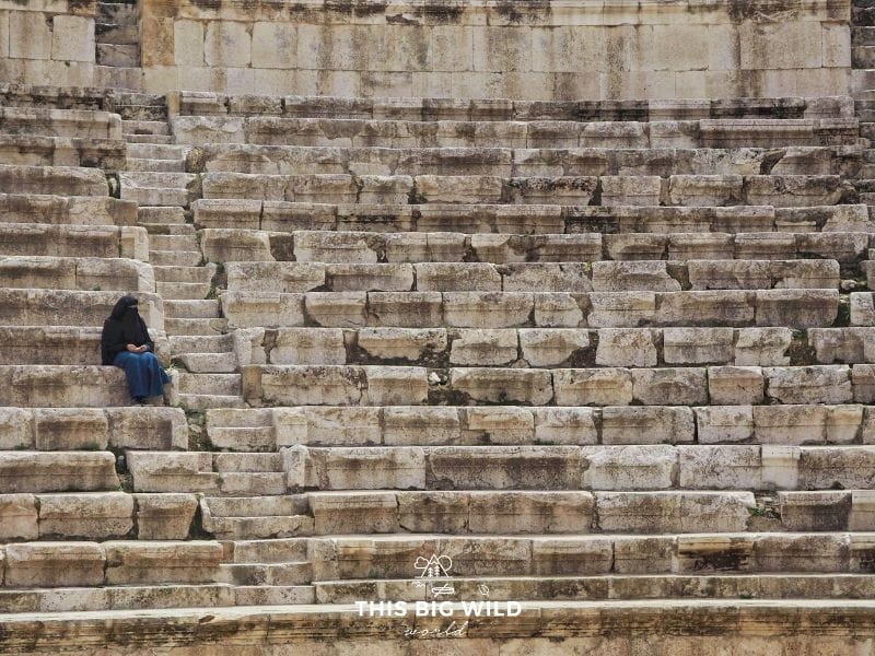 A Muslim woman sits at the Roman Amphitheater in Amman to enjoy the view of the city. The theater was built in around 150AD.
