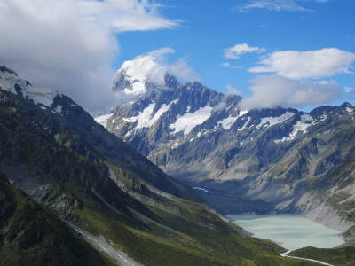 Snowcapped mountains shape the Hooker Valley in New Zealand, where the Lord of the Rings was filmed. Credit: Josy at A Walk and a Lark.
