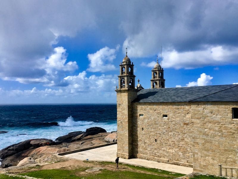 View of the Nuestra Señora dela Barca Muxia along the Camino de Santiago, taken by Paul at Minimalist Journeys.
