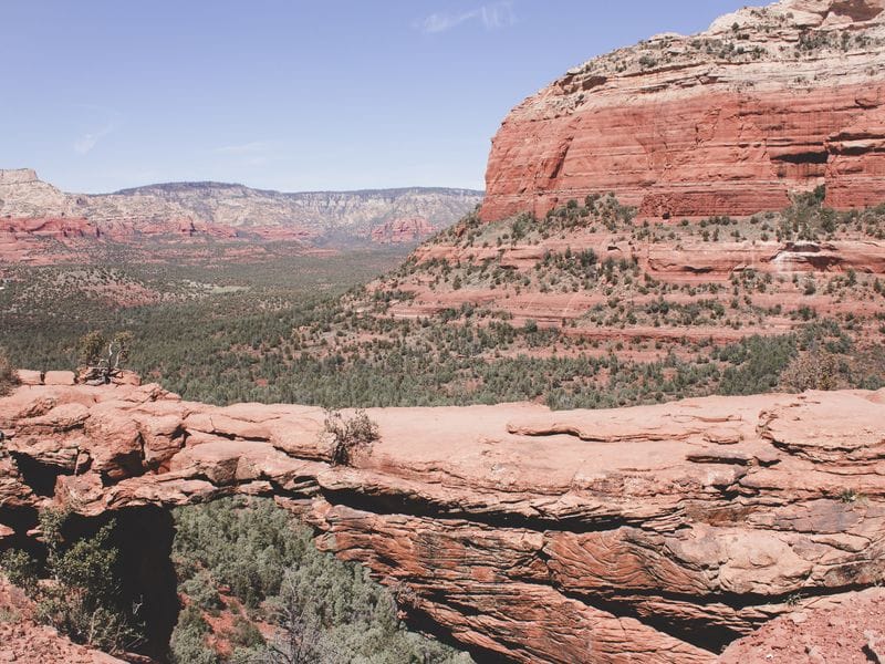 The Devil's Bridge Hike in Sedona Arizona has a moderate risk rating. The view of the red rock formations and green valley behind the bridge are worth it though! Photo Credit : Sights Better Seen