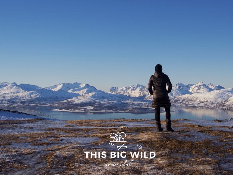 Hike around at the top of the Tromso Fjellheisen cable car for incredible views of snowcapped mountains.