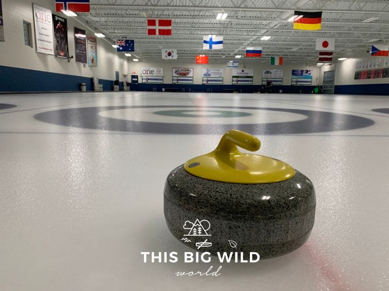 A curling stone rests on the ice before the start of a curling match in Minnesota.