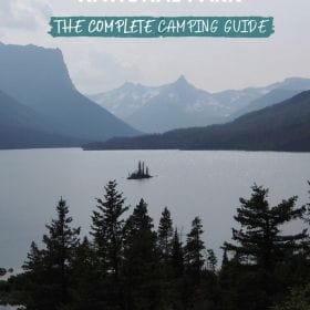 Text: Glacier National Park - the complete camping guide Image: Wild Goose Island is a small island in the middle of a lake surrounded by mountains and forest.