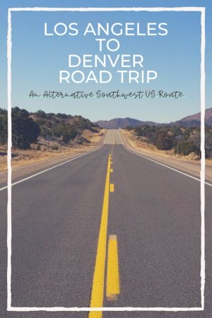 Text: Los Angeles to Denver Road Trip, An Alternative Southwest US Route.
Image: Long open road ahead with green brush and dry grass on either side. Reddish mountains are ahead in the distance under clear blue sky. A jagged white box frames the image on the pin.