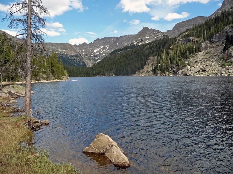 The Lake Verna Trail leads rewards you with a beautiful lake view nestled in the mountains of Rocky Mountain National Park. 