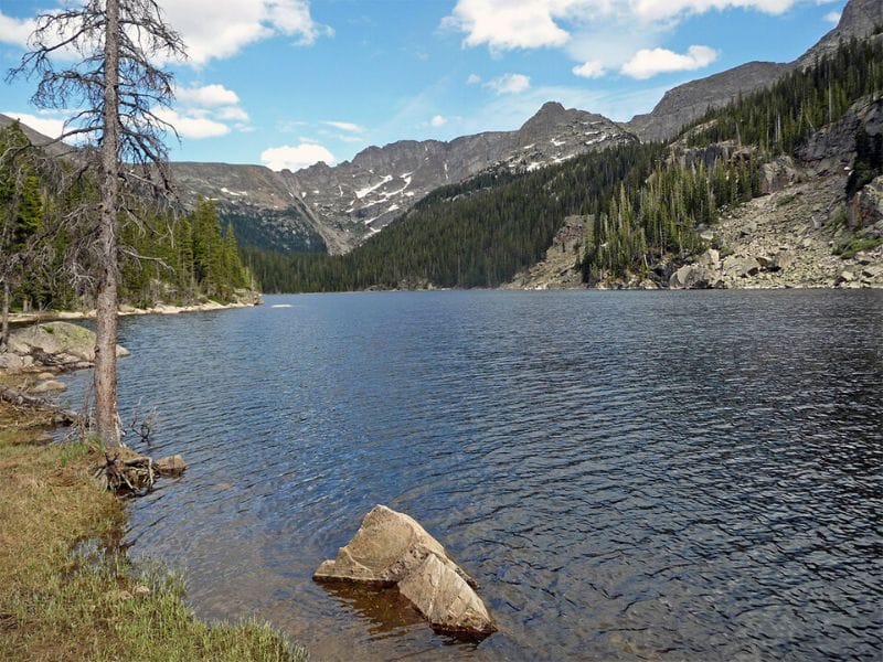 The Lake Verna Trail leads rewards you with a beautiful lake view nestled in the mountains of Rocky Mountain National Park.