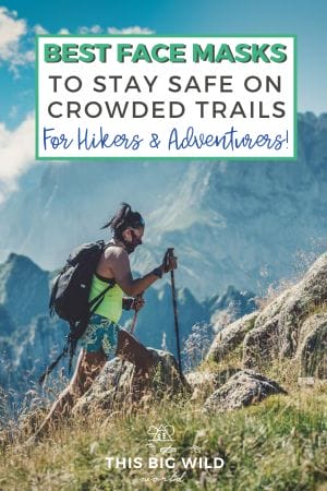 Text: Best Face Masks to Stay Safe on Crowded Trails for Hikers and Adventurers!
Image: Woman is hiking in turquoise shorts and a neon yellow top with a backpack, face mask and hiking poles. She's hiking a rocky mountain with mountains and blue sky in the distance behind her. 