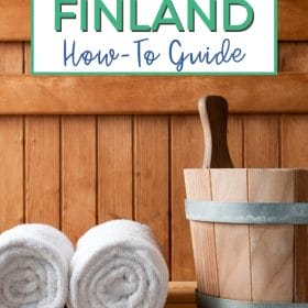 Text: Saunas in Finland How-To Guide Image: A wood-line sauna bench close up with two white towels rolled up sitting next to a wooden bucket.