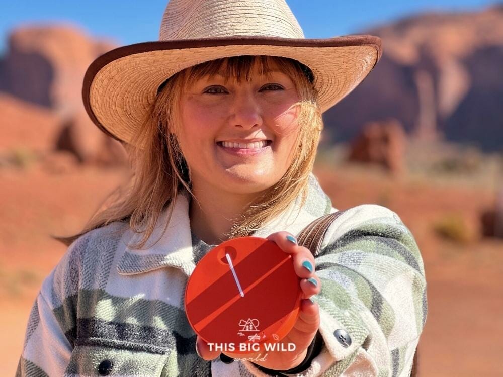 Me holding a portable wifi device in Monument Valley.