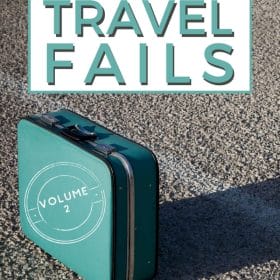 Text: My Biggest Travel Fails - Volume 2 Image: Turquoise vintage suitcase sitting in an empty parking lot, the sun casting a long shadow behind it.