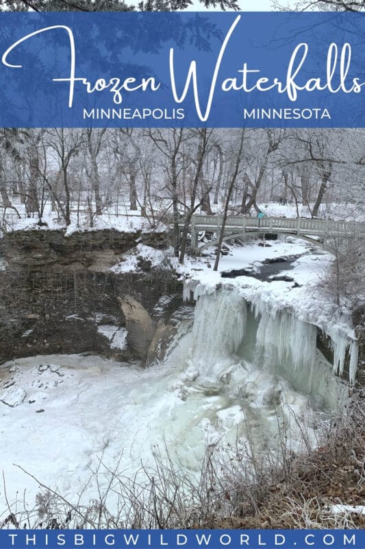 Text: Frozen Waterfalls Minneapolis Minnesota Image: Water flows under a bridge and down a waterfall that is mostly frozen creating a large icicle into a frozen pool. Surrounding the waterfall is a forest covered in a perfect dusting of snow.