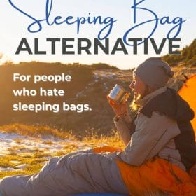Text: The Absolute Best Sleeping Bag Alternative - for people who hate sleeping bags. Image: Person sitting in sleeping next to a tent, drinking coffee while watching the sunrise.