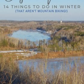 Text: Cuyuna Minnesota - 14 things to do in winter that aren't mountain biking Image: View of frozen mine pits from the Cuyuna Overlook just before sunset.