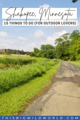 A paved trail runs through Huber Park along the Minnesota River in downtown Shakopee. Text: Shakopee, Minnesota - 15 things to do for outdoor lovers.