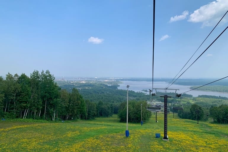 Scenic chair lift at Spirit Mountain in Duluth MN with a view of St Louis Bay and Lake Superior.