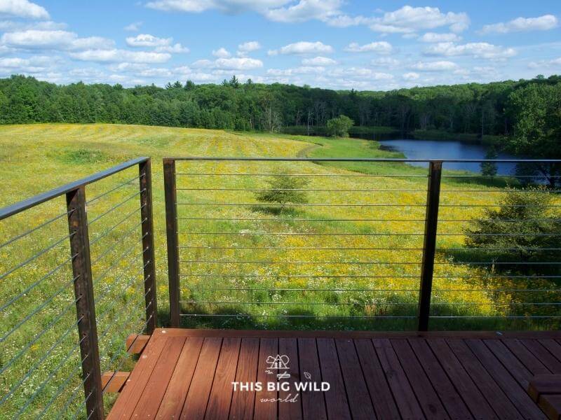Floating balcony at Nordly in Frederic Wisconsin overlooking a field of wildflowers.