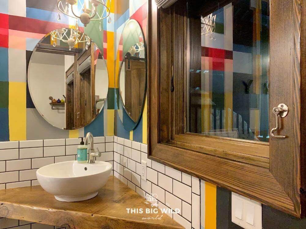 The Mayhew Inn's Plaid Cabin room has colorful plaid painted on the bathroom walls for a whimsical feel.