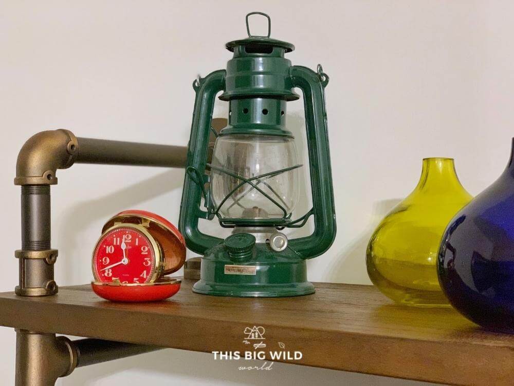 The Mayhew Inn in Grand Marais has vintage outdoor decor like this green lantern and red pocket watch.