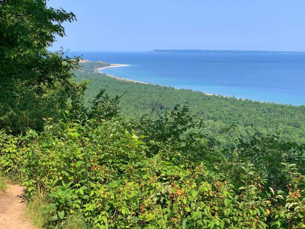 Islands Lookout Point on the Alligator Hill Hike with view of bright blue water of Lake Michigan.