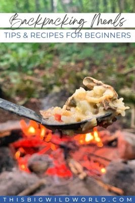 Text: Backpacking meals - tips and recipes for beginners. Image: Spoon of food in front of a campfire in the forest.