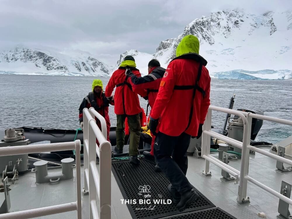 Passengers boarding a zodiac boat from the MS Fridtjof Nansen expedition launch area in Antarctica.