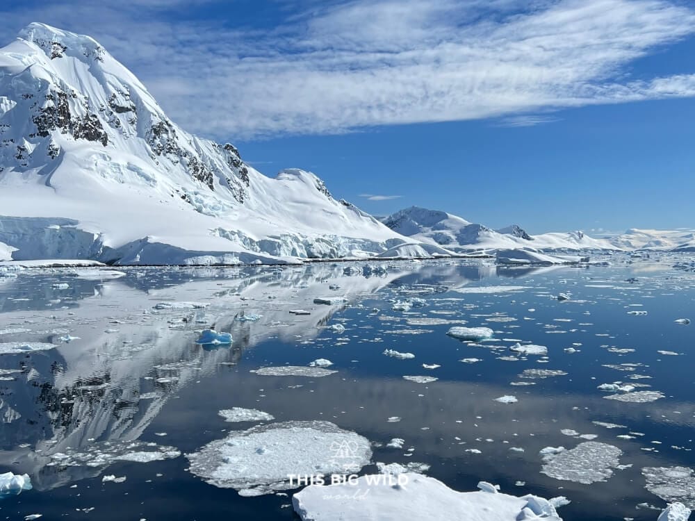 Reflection of a snow covered mountain in the Lemaire Channel in Antarctica.