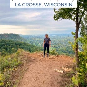 Text: Perfect Weekend Getaway La Crosse Wisconsin Image: Me standing on top of a bluff overlooking La Crosse.