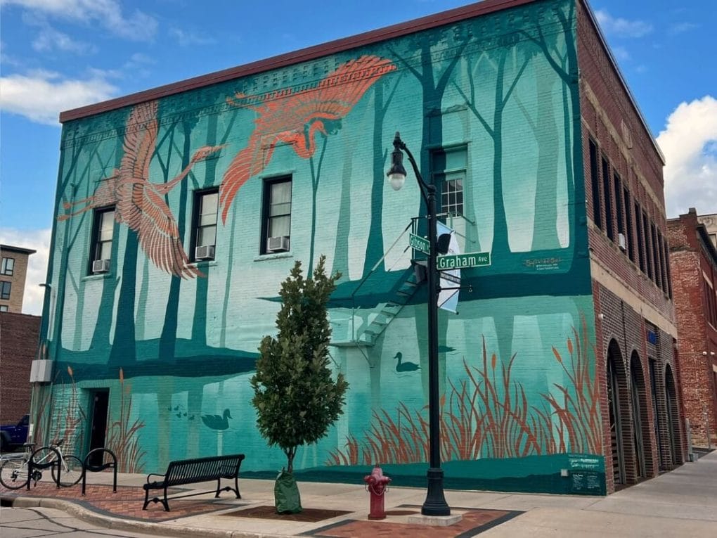 The "sanctuary" mural in downtown Eau Claire is just one of dozens to see in the city.